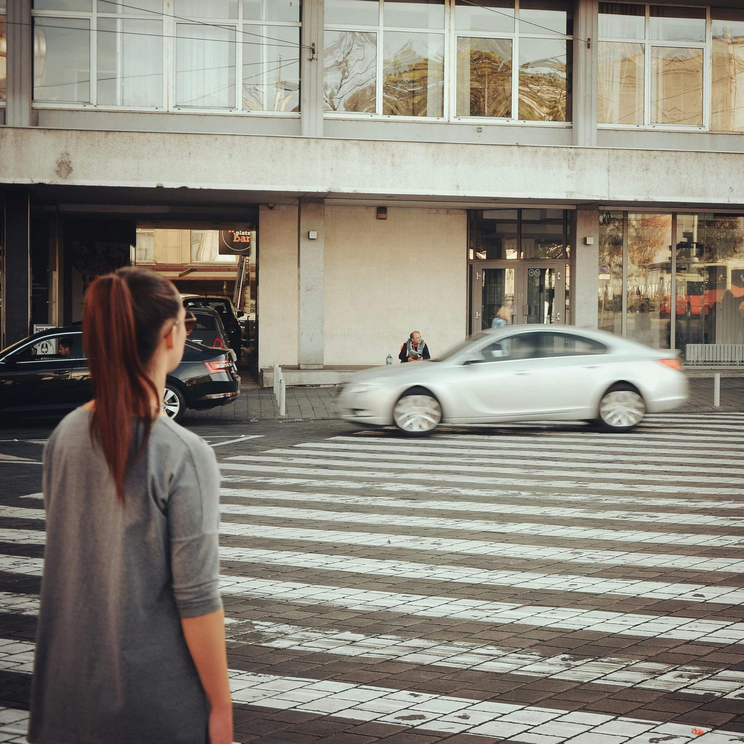 Person standing at crossroads representing growth mindset choices.