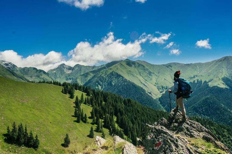 A determined person climbing a mountain, representing the growth mindset and lifelong success.