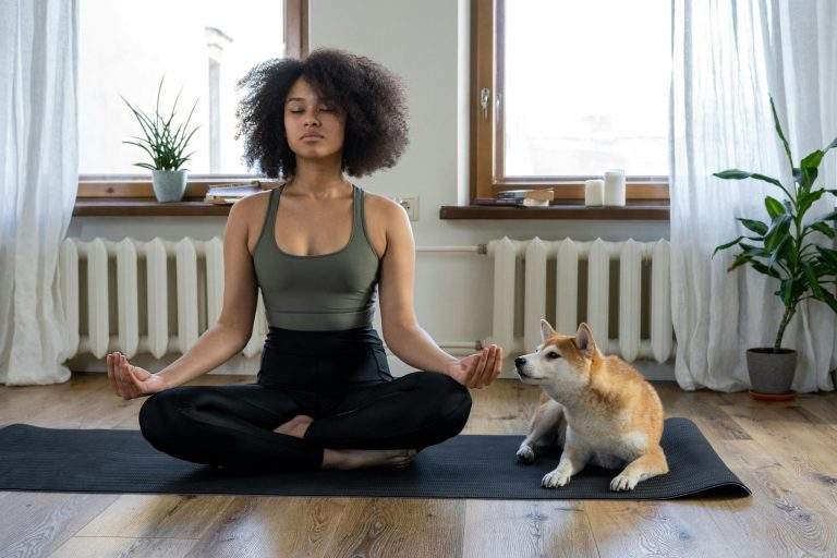 Person meditating outdoors for mindfulness and self-awareness