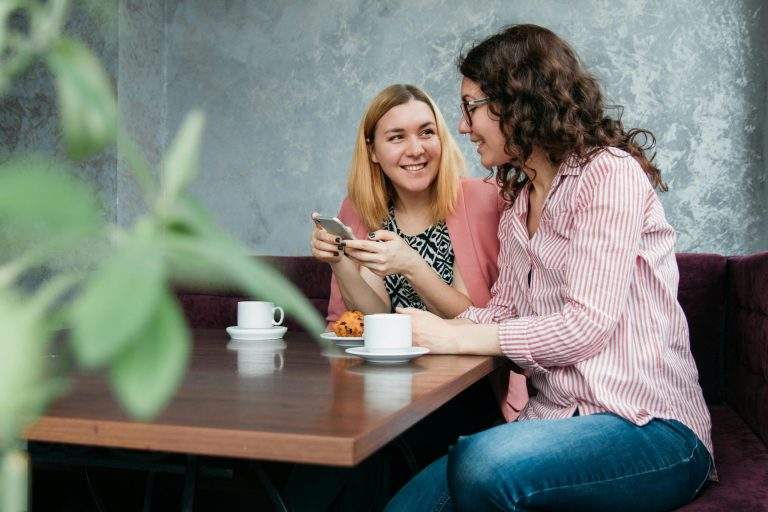 Group of people celebrating overcoming limiting beliefs