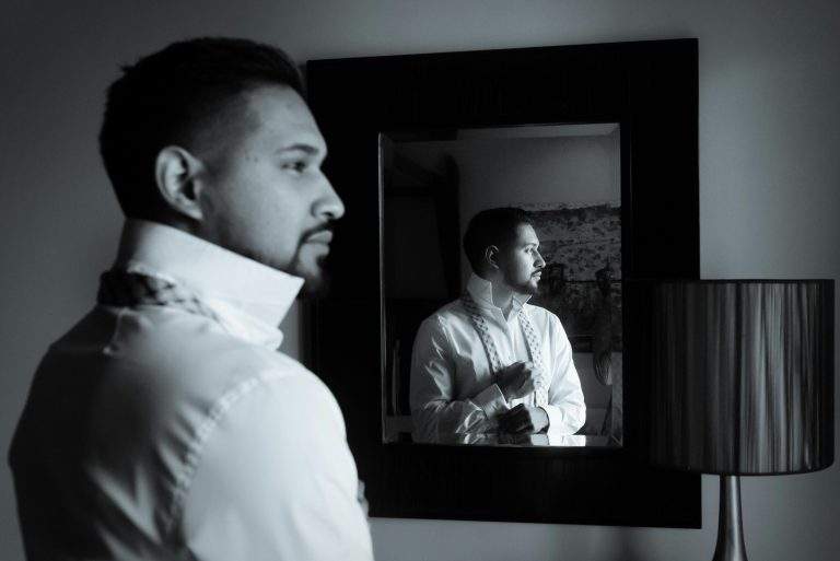 Person reflecting in a mirror on core values that shape decisions and actions