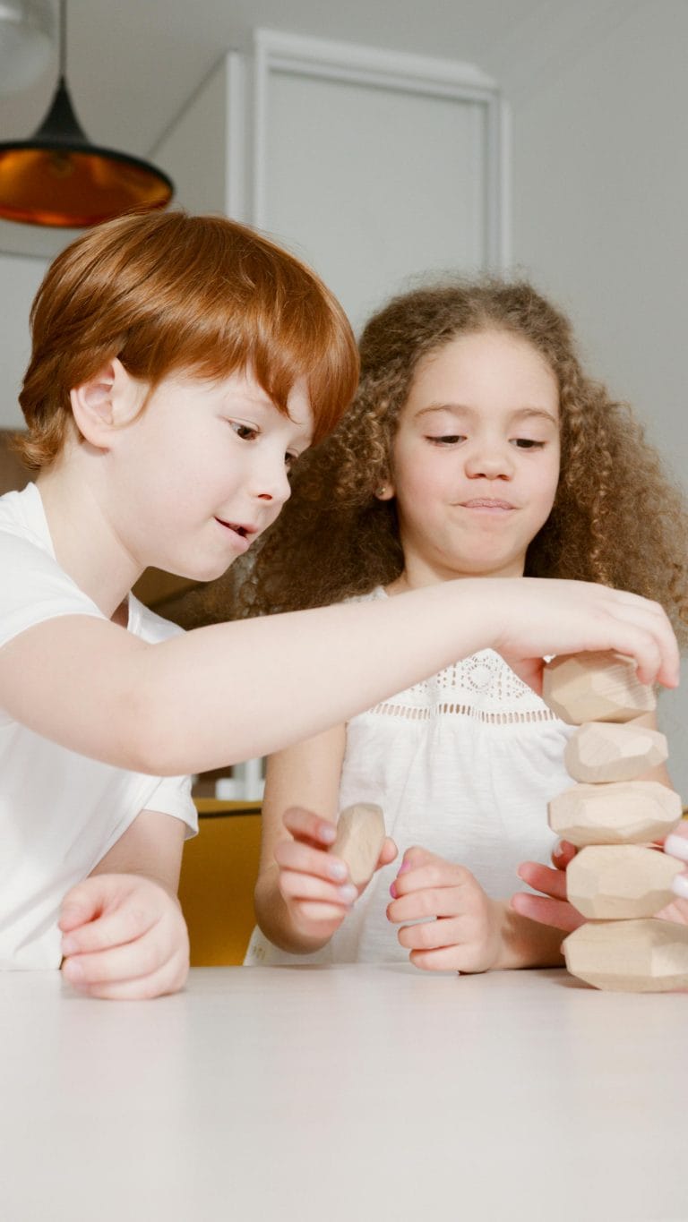 Children and teens developing resilience through problem-solving, guided by supportive parents and educators.