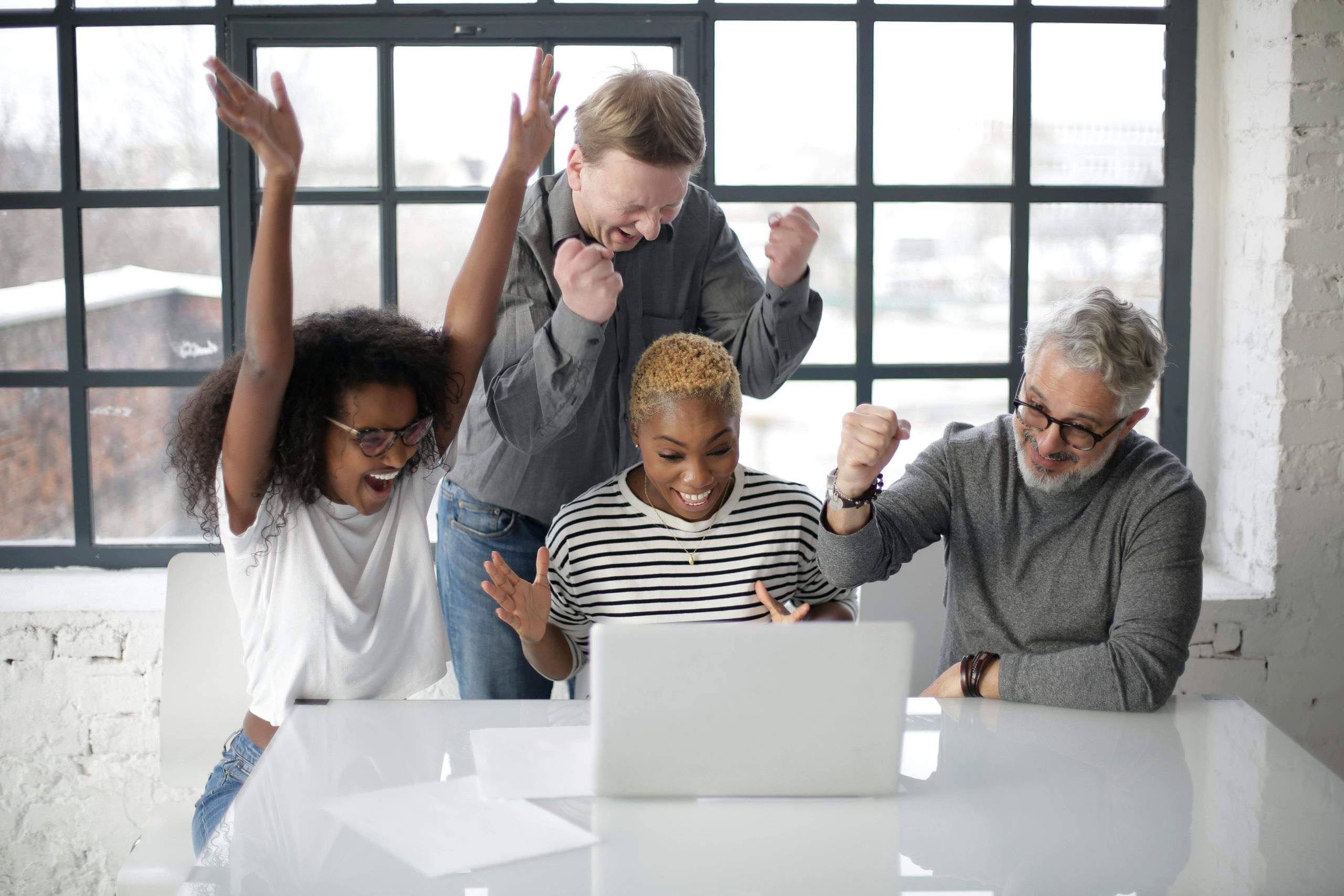 Person celebrating a small win while focusing on a long-term goal, representing motivation and success balance.