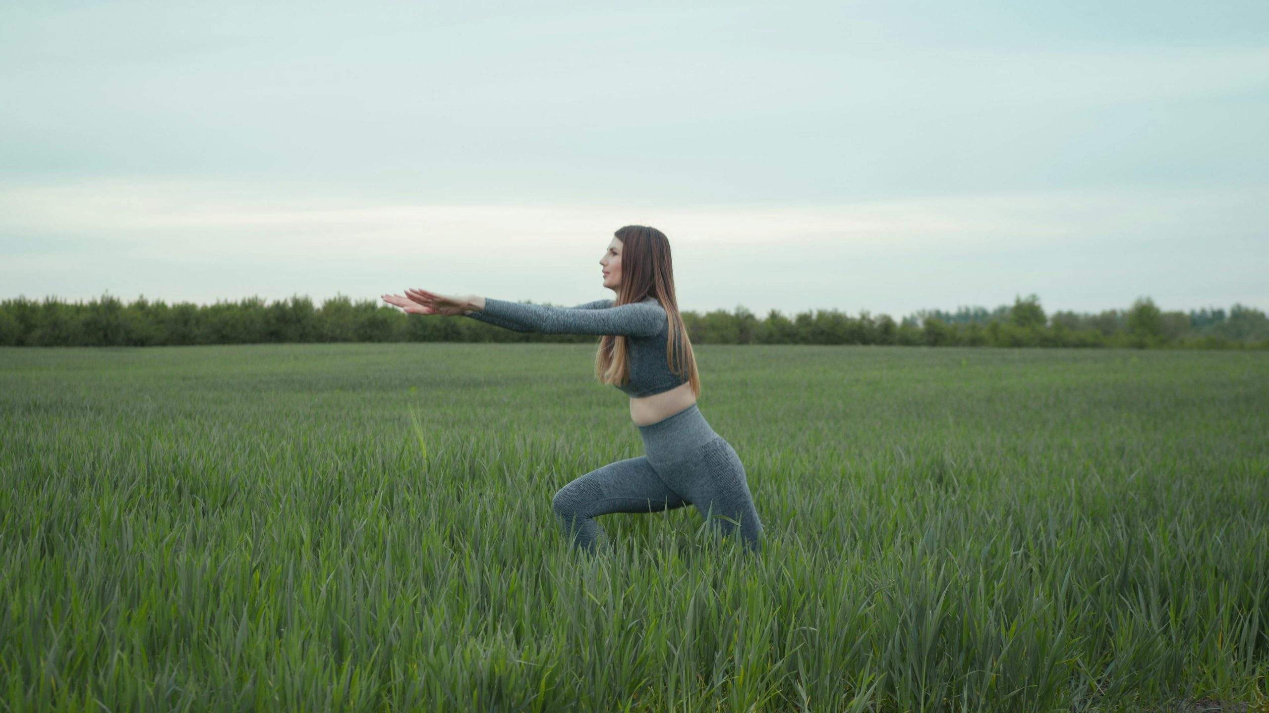 Person practicing mindful breathing outdoors to reduce stress and enhance mental clarity.