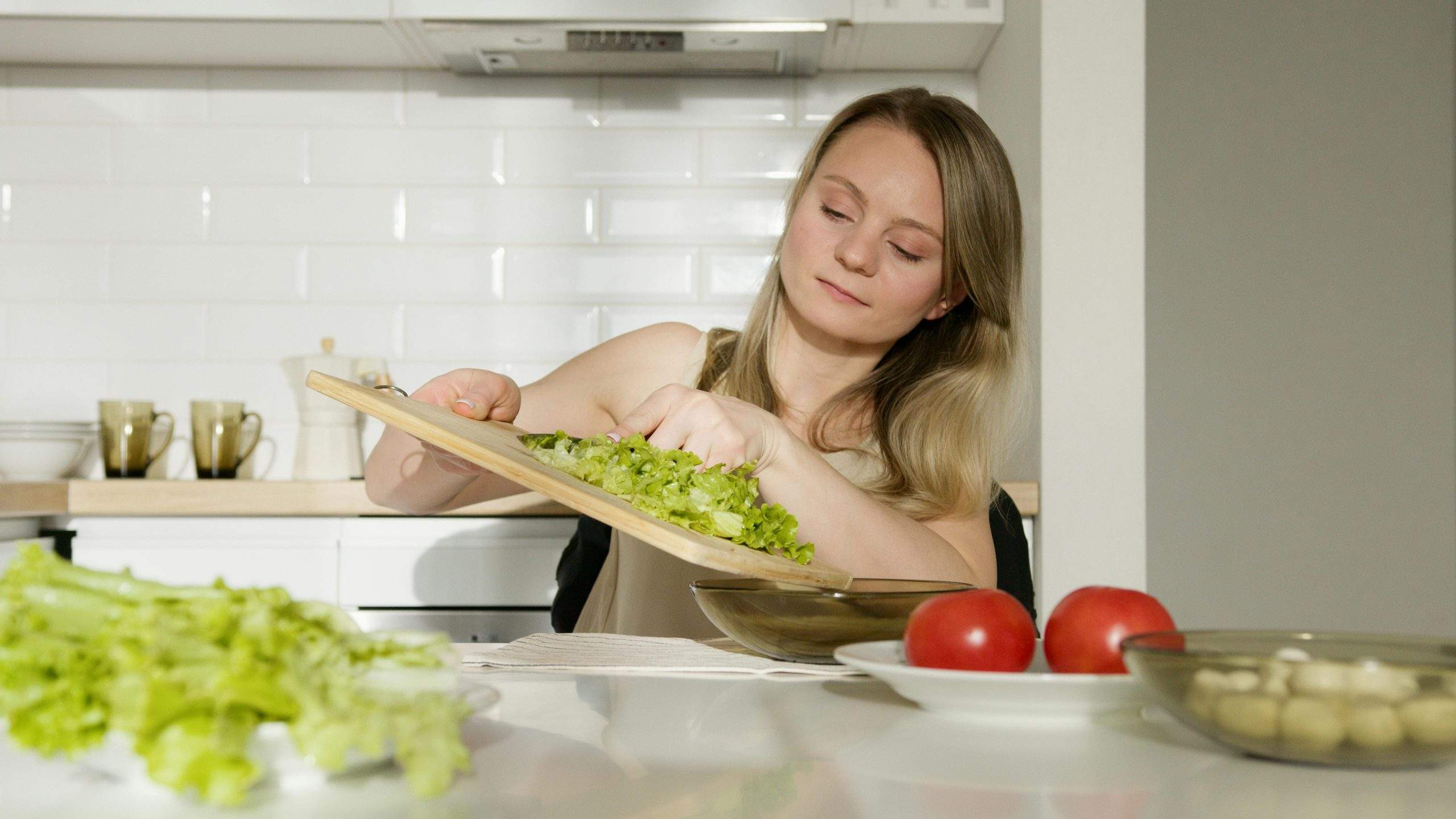 Person practicing mindful eating by chewing slowly and focusing on food.