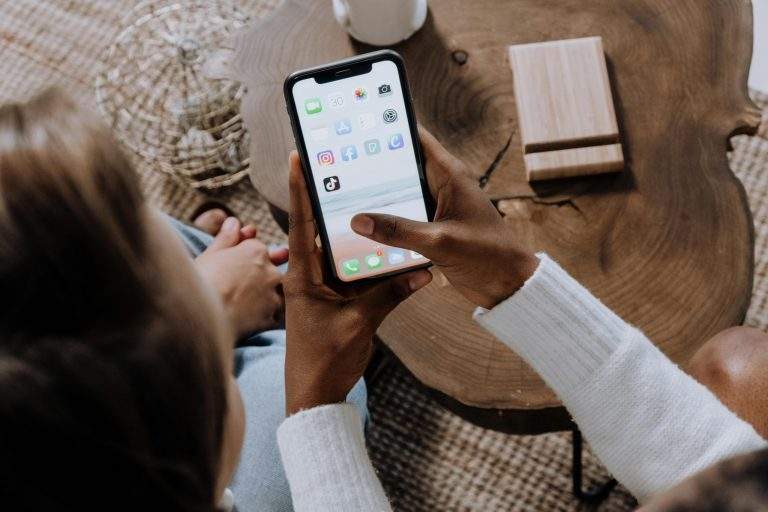 Person using a mindfulness app on their phone for personal growth