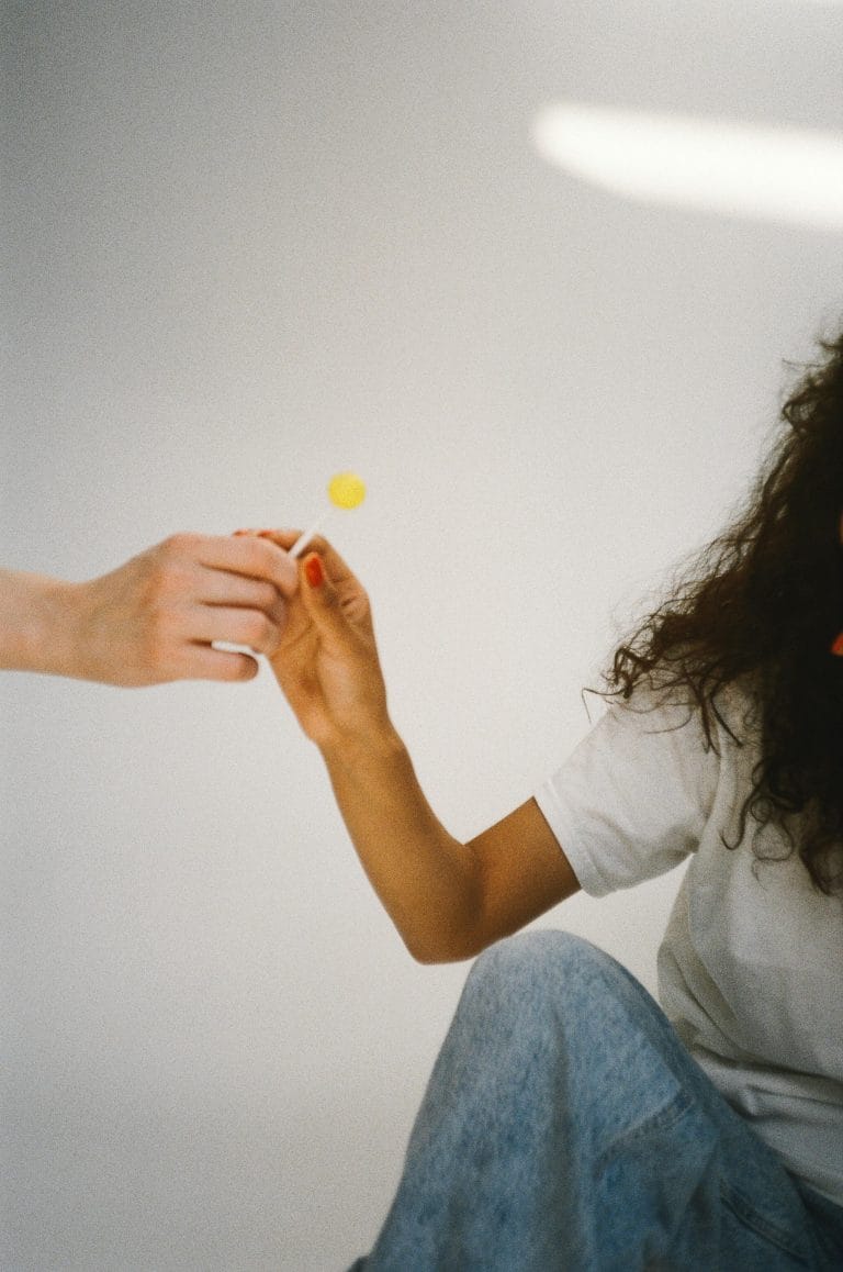 Person offering a helping hand, symbolizing hope and kindness.