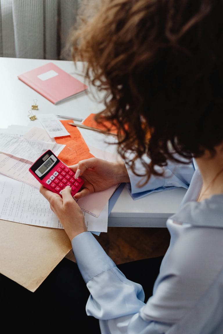 Focused person working at a clutter-free desk, maximizing productivity.