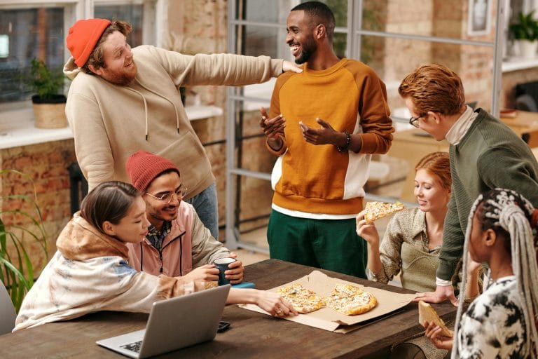 People connecting through sharing and open conversations, fostering empathy and trust.