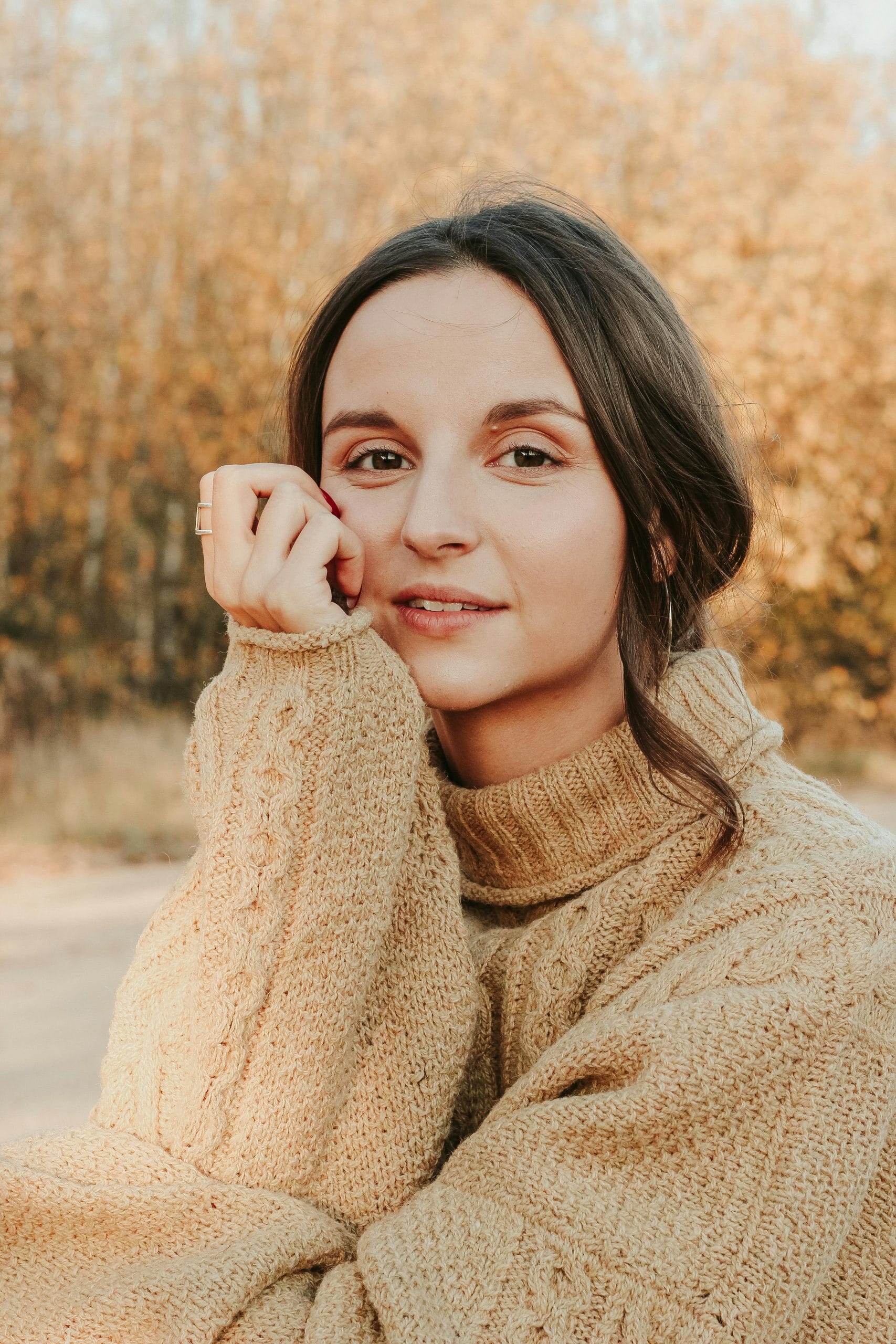 Person smiling warmly, symbolizing kindness and hope.