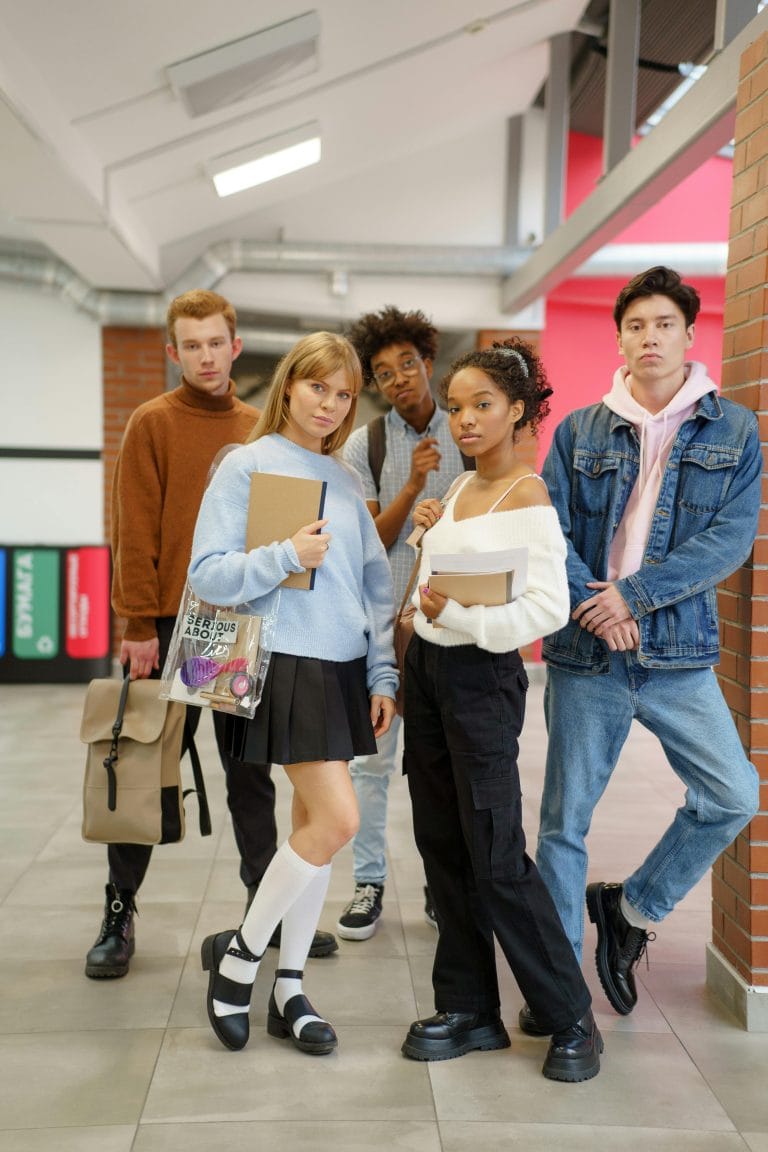 Students in high school hallway showing shoving incident.