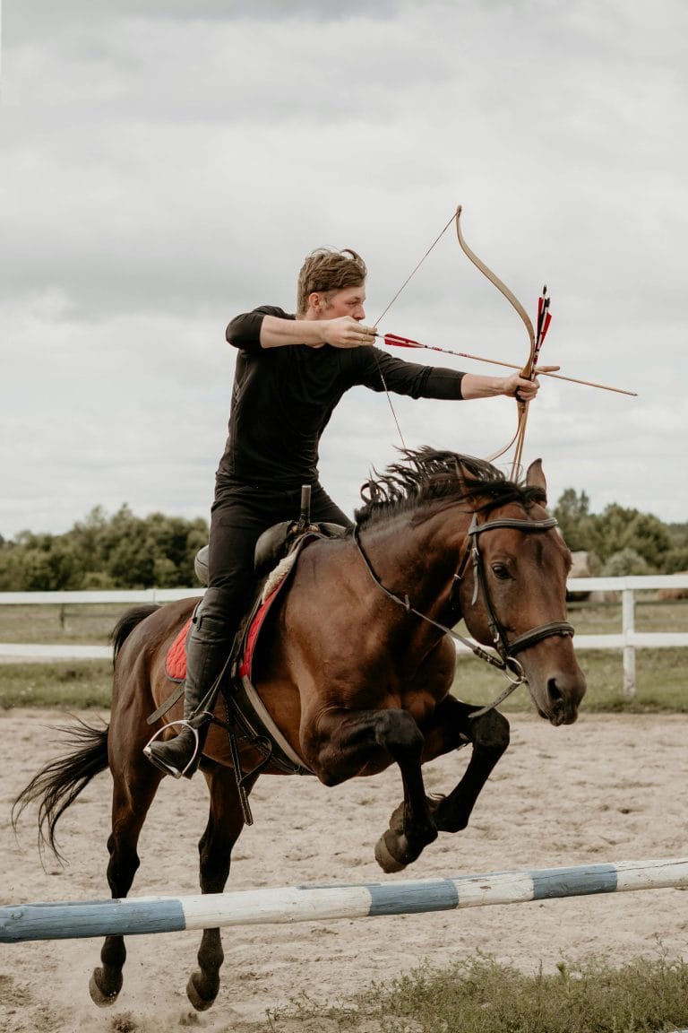 Archer focusing on target, showcasing mental skills in action.