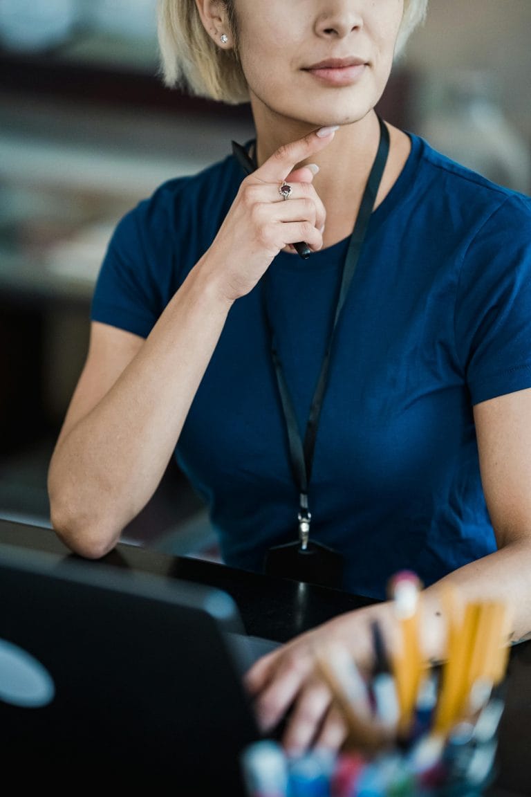 Person working mindfully at a desk, balancing productivity and well-being.