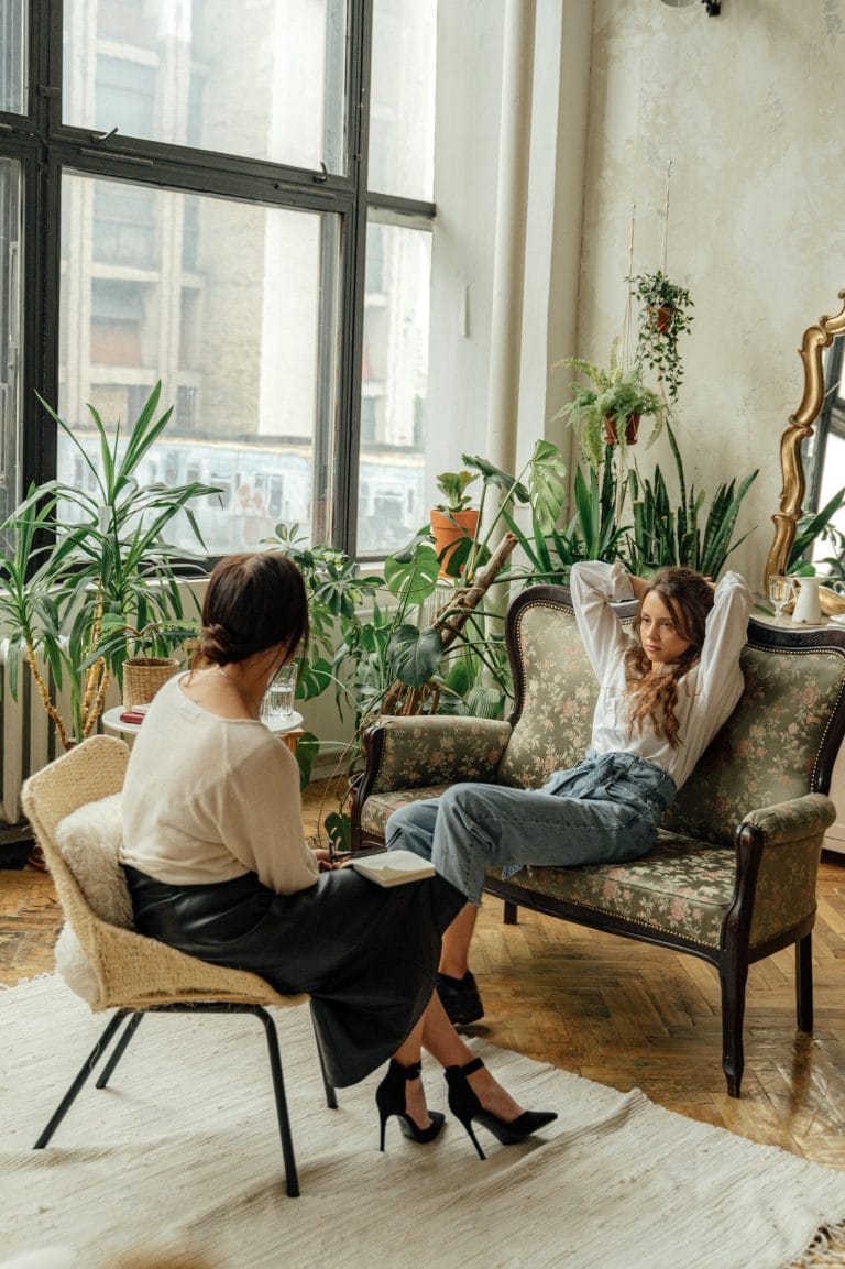 Two individuals engaging in a respectful conversation, practicing nonviolent communication to express expectations clearly.