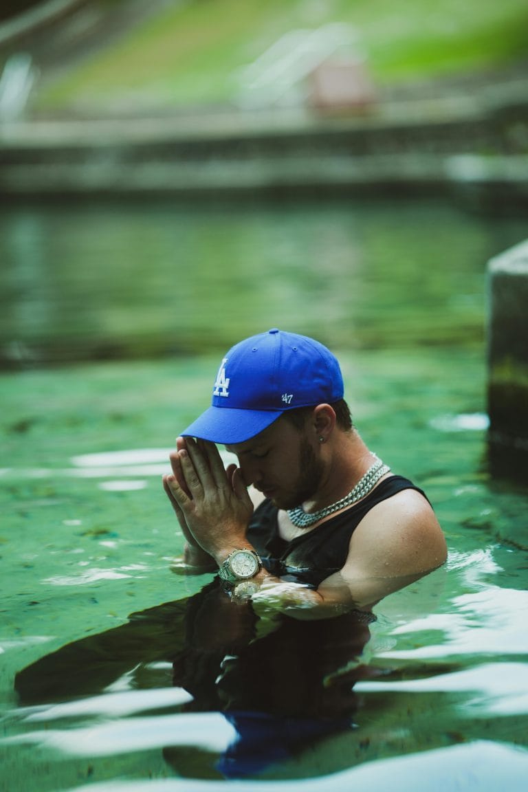 Person praying in a serene setting, finding healing from depression through faith and spiritual connection.