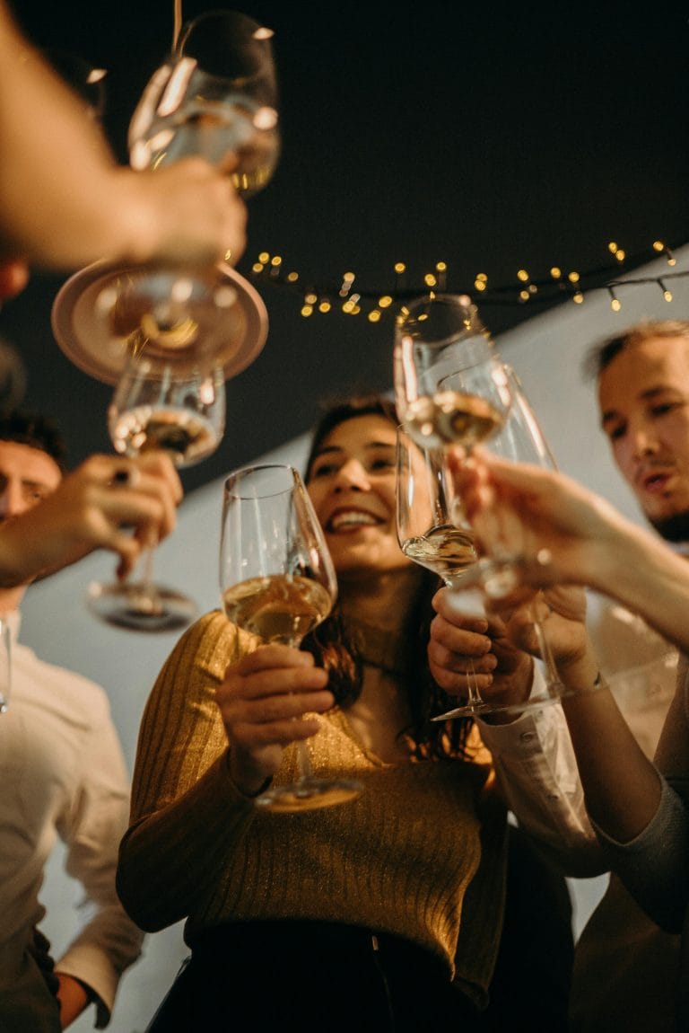 Group of friends at a Saturday happy hour engaging in meaningful conversations to boost personal growth.