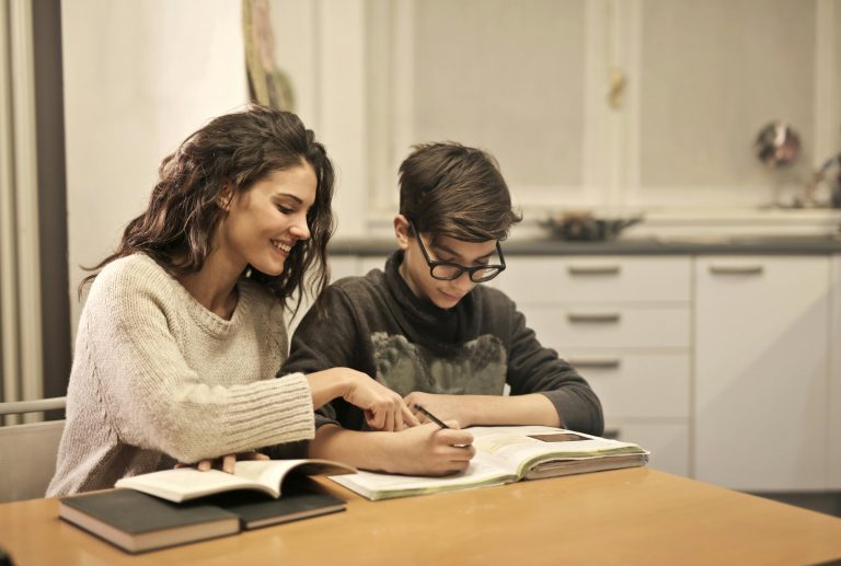 A person studying a book, representing how education leads to personal and professional success.