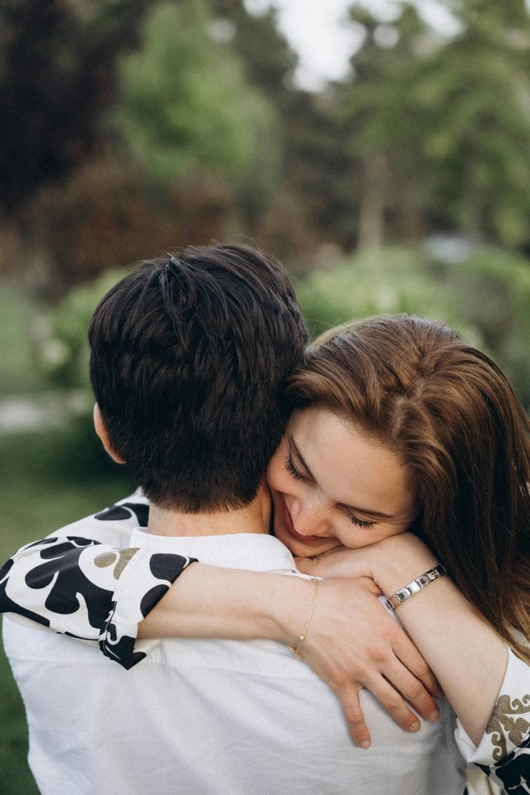 Couple smiling and embracing to reconnect emotionally