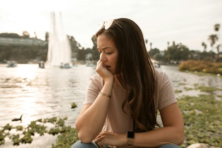 Person reflecting alone, symbolizing self-abandonment recovery